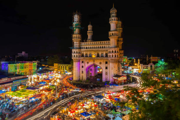 Long Exposure Shot of Traffic moving around Charminar during ramadan season on the night of eid in hyderabad, india.